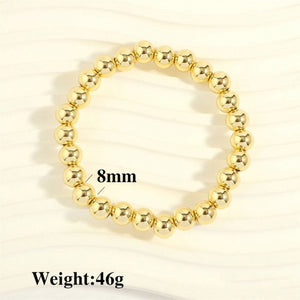 Gold Ball Stretch Bracelet, medium 3/8” (8 mm)