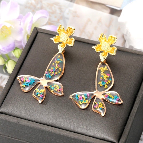 BUTTERFLIES AND BEES Collection: Lucite Butterfly with Real Flowers, Earrings only (designed Fall 2023)