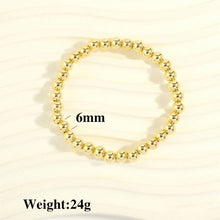 Load image into Gallery viewer, Gold Ball Stretch Bracelet, small 1/4” beads (6 mm)